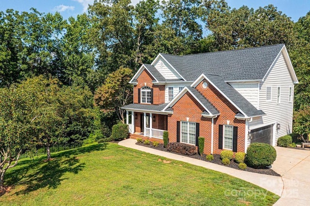 view of front of house featuring covered porch, brick siding, concrete driveway, roof with shingles, and a front yard