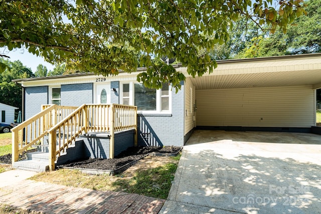 view of front of property with a carport