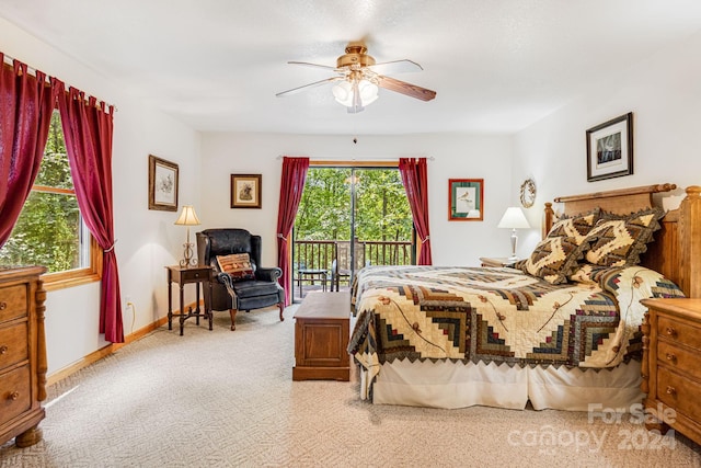 carpeted bedroom with baseboards, ceiling fan, and access to outside