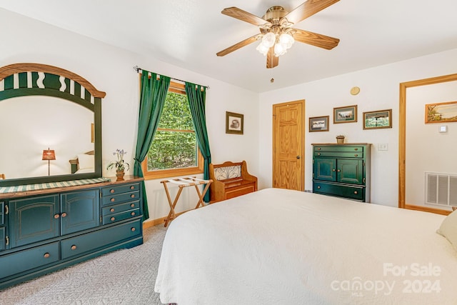 bedroom featuring visible vents, a ceiling fan, and carpet