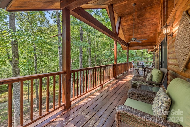 wooden terrace featuring ceiling fan