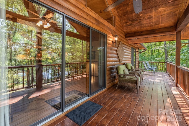 wooden terrace with a ceiling fan