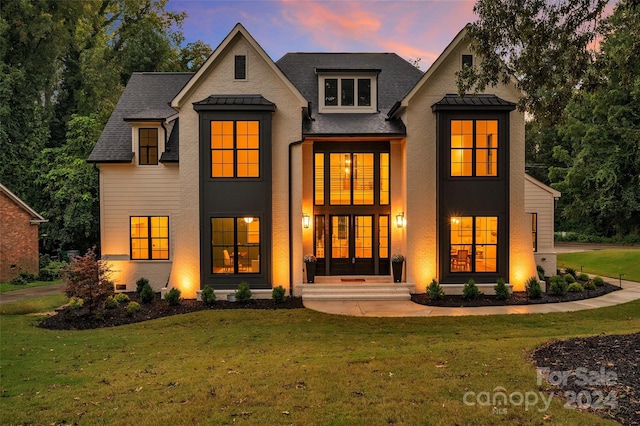 view of front of home with a yard