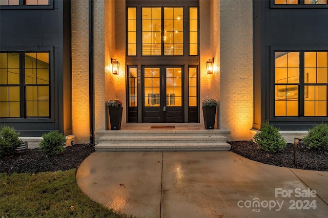 view of exterior entry featuring french doors