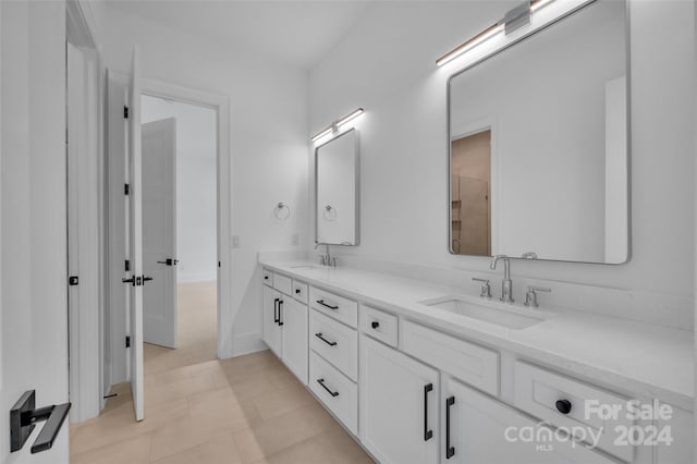 bathroom featuring vanity and tile patterned flooring