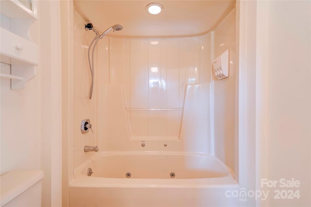 bathroom with toilet and tub / shower combination