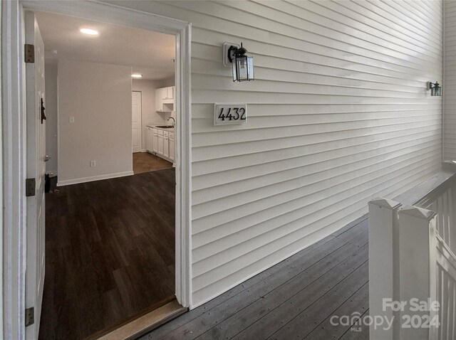 interior space featuring sink and hardwood / wood-style flooring