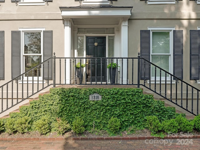 1218 Wareham Ct, Charlotte, NC 28207 - property entrance with stucco siding