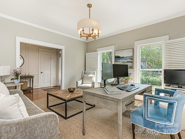 living room with ornamental molding, dark hardwood / wood-style floors, and a chandelier