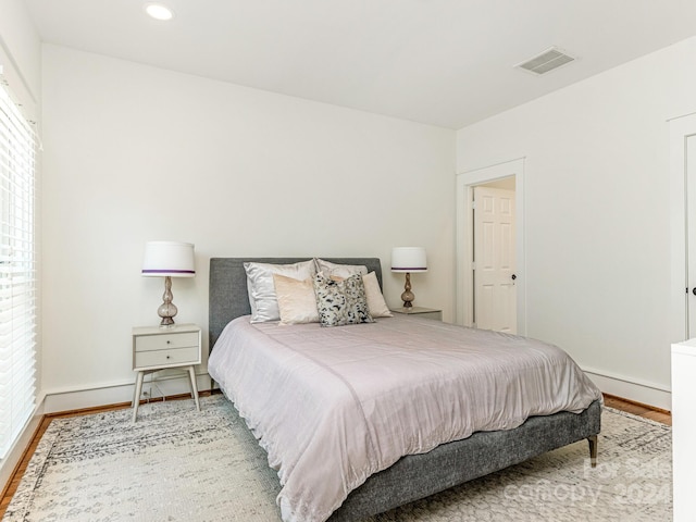 bedroom with light wood-type flooring