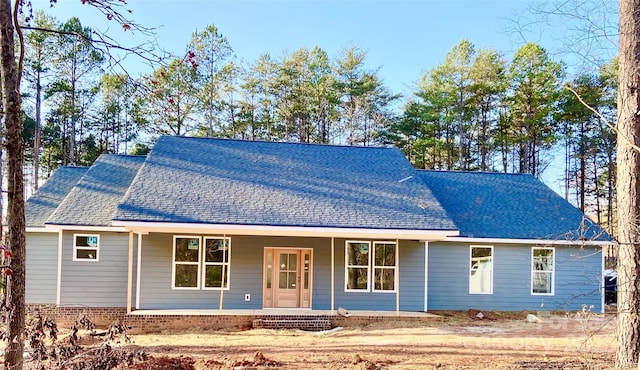 ranch-style home featuring covered porch