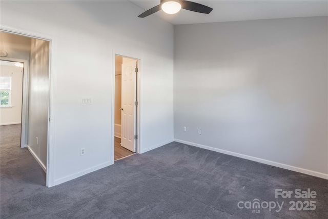 unfurnished bedroom with baseboards, a ceiling fan, and carpet flooring