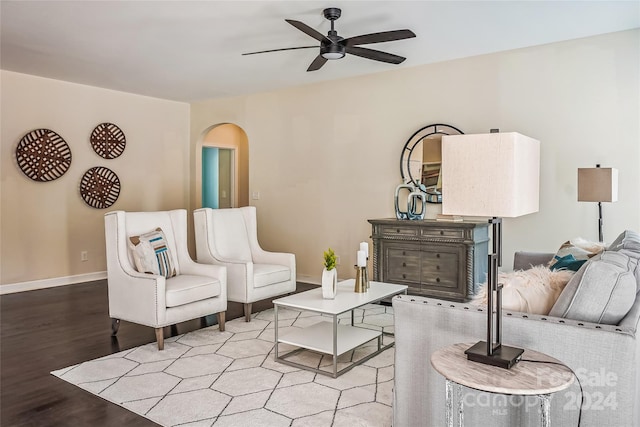 living room featuring light hardwood / wood-style flooring and ceiling fan