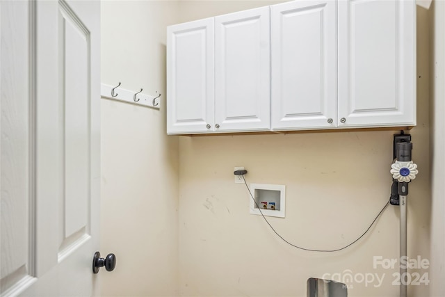 washroom featuring cabinets, hookup for an electric dryer, and washer hookup