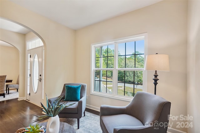 living area with hardwood / wood-style flooring