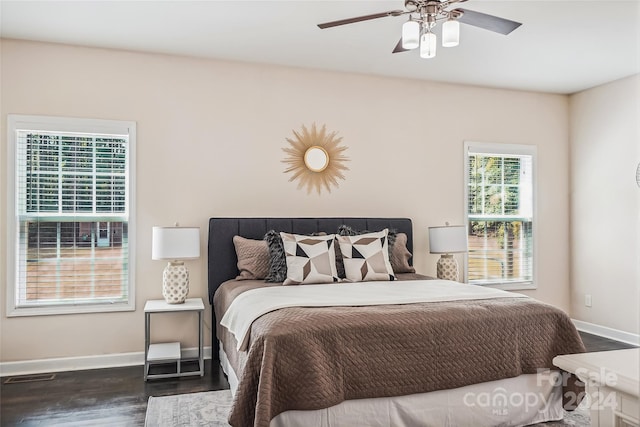 bedroom featuring dark hardwood / wood-style flooring and ceiling fan