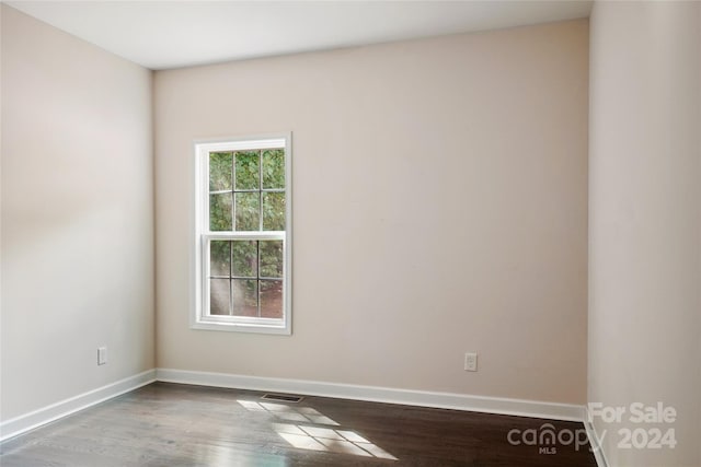 spare room featuring hardwood / wood-style floors