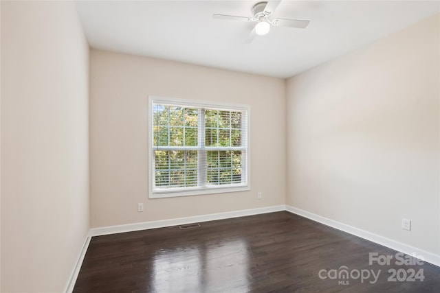 unfurnished room featuring ceiling fan and dark hardwood / wood-style flooring