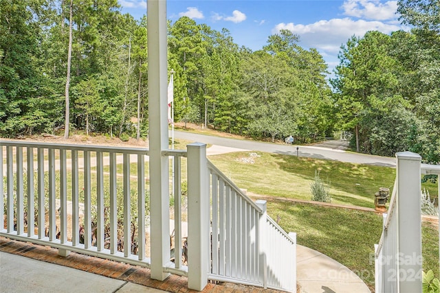 view of gate featuring a yard