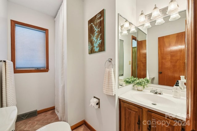 bathroom with tile patterned flooring and vanity