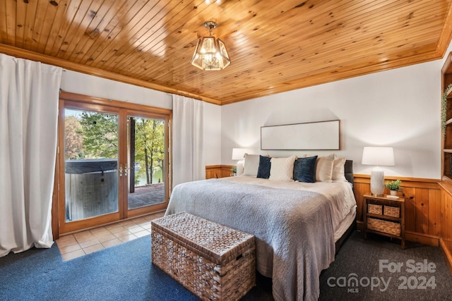 bedroom featuring wood walls, wood ceiling, and access to exterior