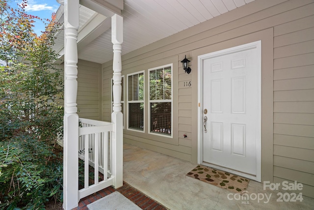 doorway to property with a porch