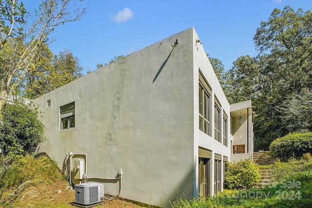 view of property exterior featuring central AC unit