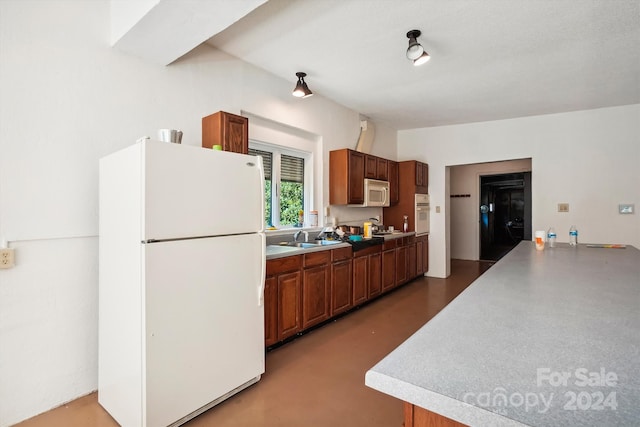 kitchen with sink and white appliances