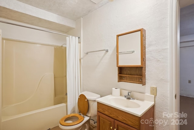 full bathroom with toilet, vanity, a textured ceiling, and shower / bath combo with shower curtain