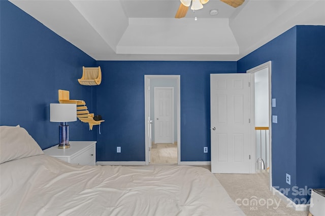 bedroom with a ceiling fan, carpet, and baseboards