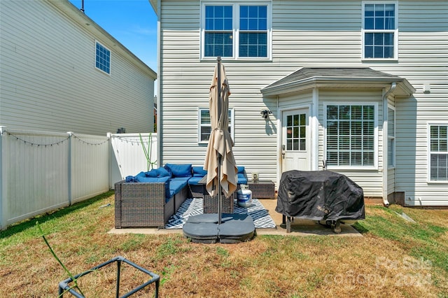 back of house featuring an outdoor hangout area, a lawn, a patio area, and a fenced backyard