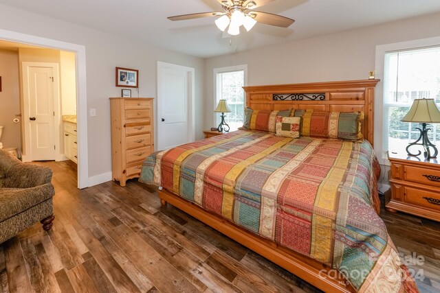 bedroom with ceiling fan and dark hardwood / wood-style floors