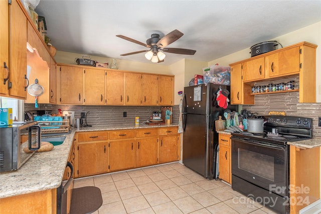 kitchen with black appliances, ceiling fan, light tile patterned floors, and tasteful backsplash