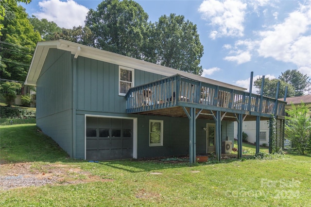 back of house with a garage, a yard, and a deck