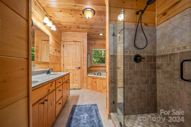 bathroom with tile patterned flooring, separate shower and tub, wooden ceiling, and vanity