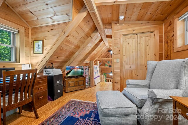 living area featuring vaulted ceiling, hardwood / wood-style floors, wooden walls, and wooden ceiling