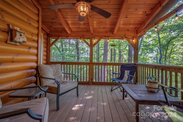 wooden terrace featuring ceiling fan