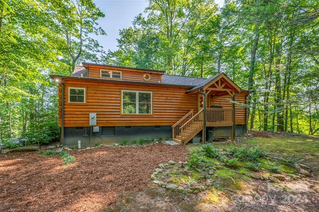 rear view of house with a deck