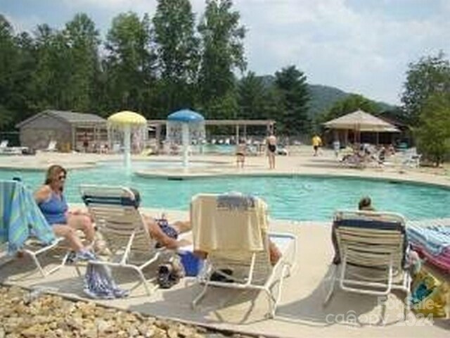 view of pool with pool water feature