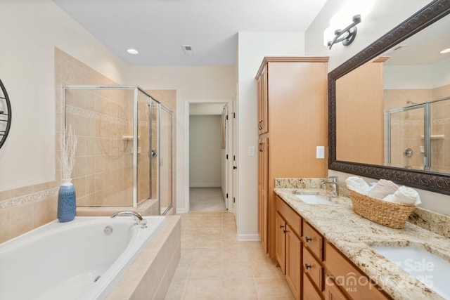 bathroom featuring tile patterned flooring, vanity, and separate shower and tub