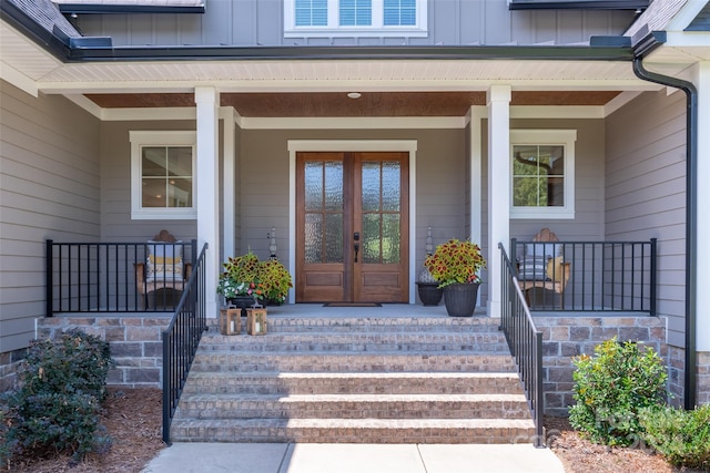 property entrance featuring french doors and covered porch