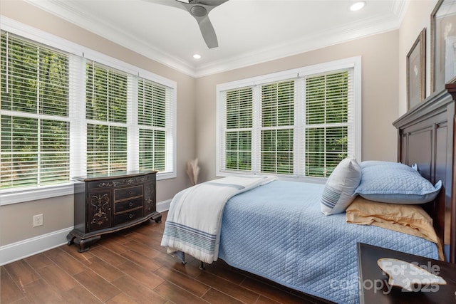 bedroom with ceiling fan, ornamental molding, baseboards, and wood finish floors