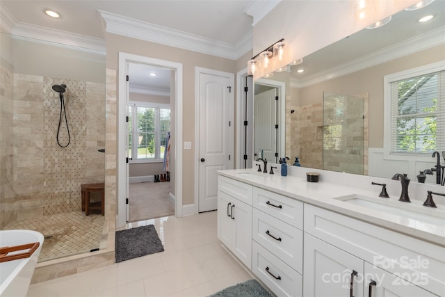 bathroom featuring shower with separate bathtub, tile patterned floors, vanity, and crown molding