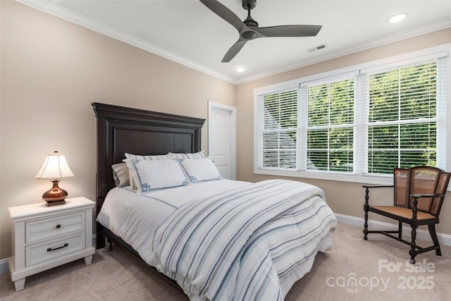 carpeted bedroom featuring crown molding and ceiling fan