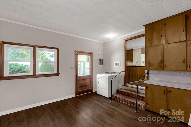 foyer featuring washer / dryer, dark hardwood / wood-style floors, and crown molding