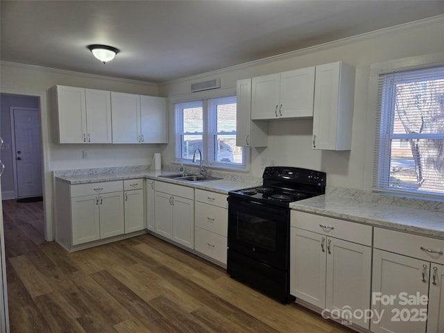 kitchen with black electric range oven, sink, crown molding, dark hardwood / wood-style floors, and white cabinets