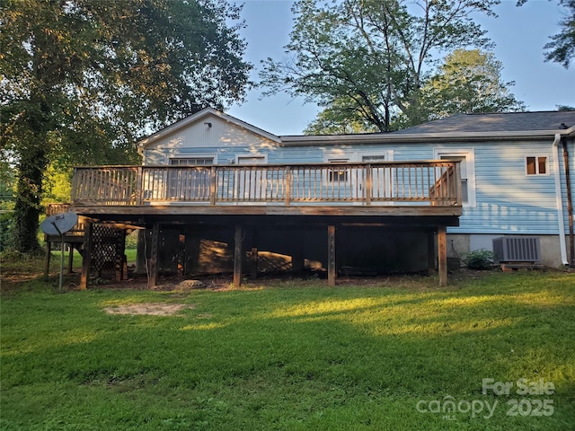 back of property featuring a yard, a deck, and central air condition unit