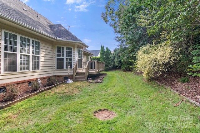 view of yard featuring a wooden deck