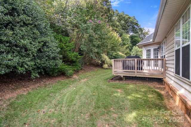 view of yard with a deck