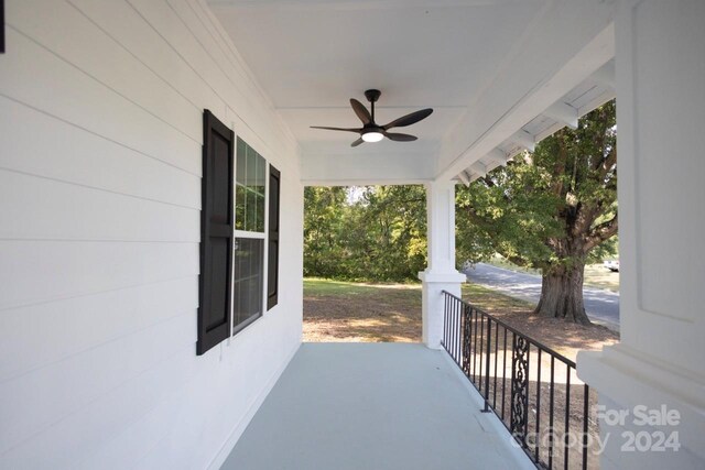 view of patio featuring a porch and ceiling fan